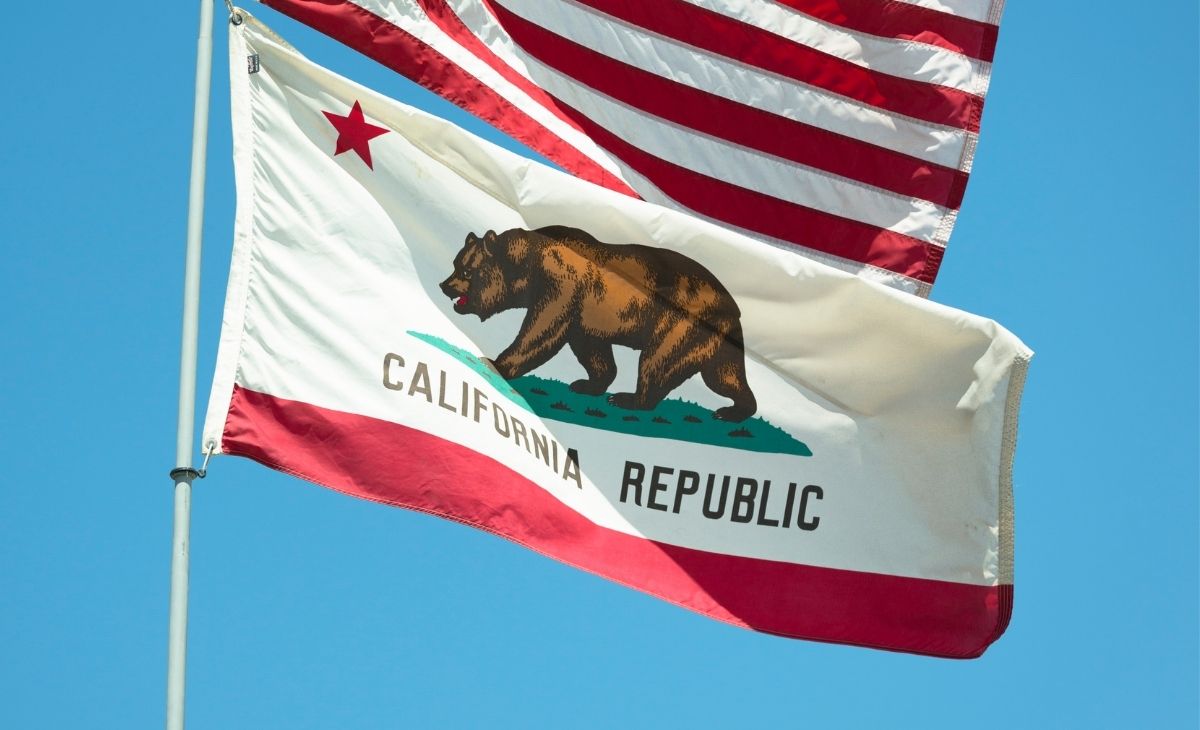 Image of the California flag, with the bottom half of the US flag displayed above,